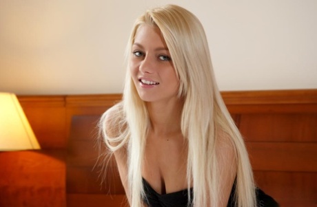 Beautiful glamour model Grace C slipping satin panties over tight ass