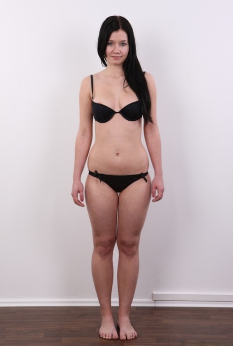 Dark haired girl Zdenka stands naked while launching her nude modeling career