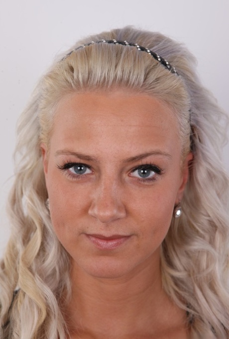 Blond girl Nikola takes a turn at being a nude model by taking off her clothes