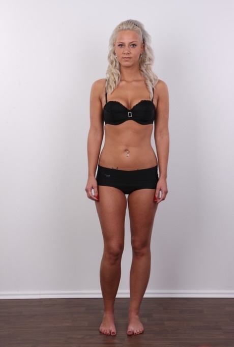 Blond girl Nikola takes a turn at being a nude model by taking off her clothes