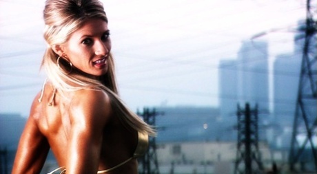 Fitness model Abby Marie displays her great body while wearing a shiny bikini