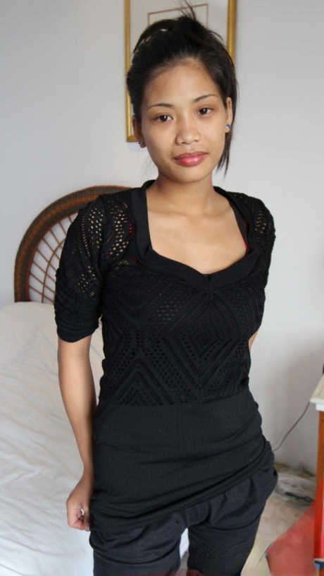 Thin Filipino girl shows off her her bald pussy before jerking a sex tourist