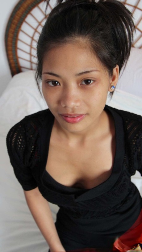 Thin Filipino girl shows off her her bald pussy before jerking a sex tourist