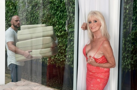 Hot granny Leah L'Amour greets her young lover at door for afternoon quickie