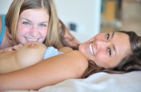 Hot Asian teenager is joined by her lesbian lover in their bed