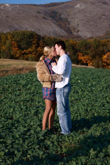 Blonde girl and her boyfriend have sex in a crop field away from prying eyes