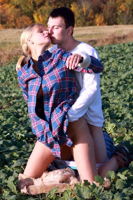 Blonde girl and her boyfriend have sex in a crop field away from prying eyes