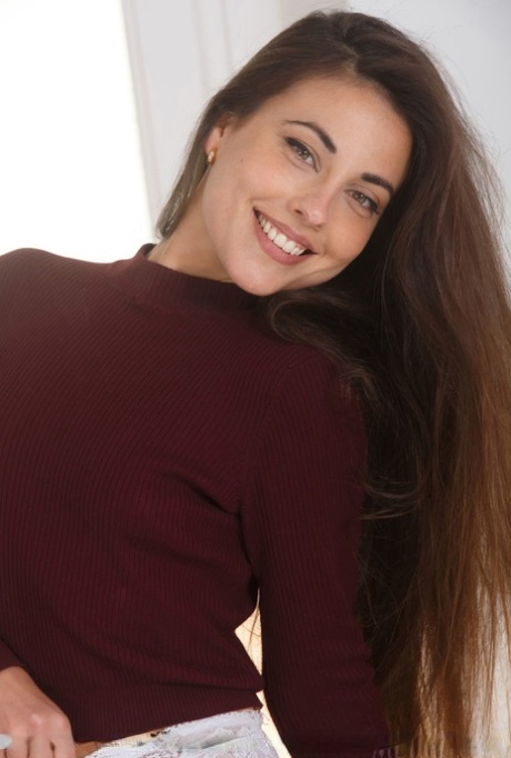 Nice young girlLorena B sports a nice smile while showing her legs