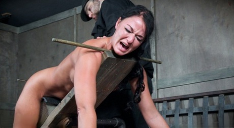 Submissive female London River is tied up with rope and spanked