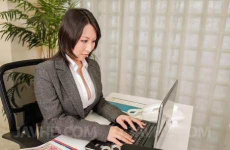 Japanese female executive Yuuna Hoshisaki demonstrates how to use a Fleshlight