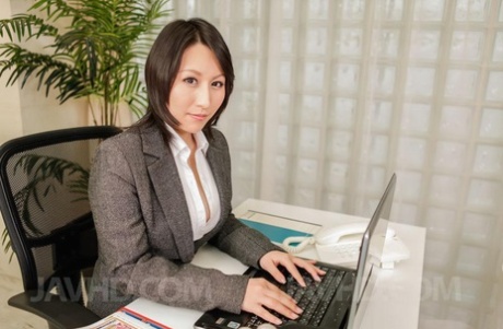 Japanese female executive Yuuna Hoshisaki demonstrates how to use a Fleshlight