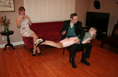 Leggy blonde Violet October has her bare ass spanked by Nikki Rouge's husband