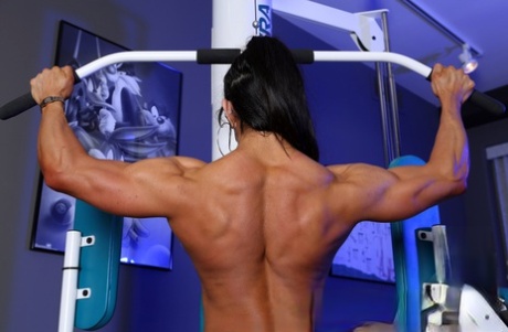Busty bodybuilder Marina Lopez shows her ropy physique naked at the gym