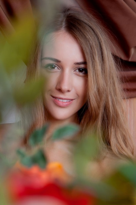 Skinny girl Lina Diamond whiles way the afternoon sitting naked in the window