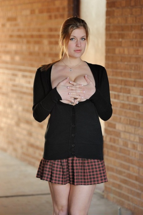Amateur abbe letting big natural schoolgirl tits loose outdoors in socks
