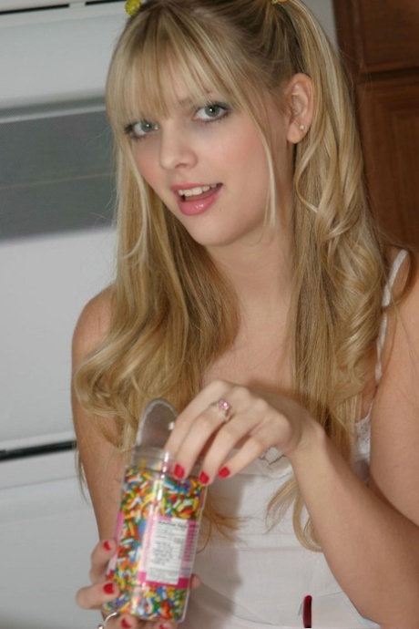 Cutie Jana Jordan in socks & frilly skirt flashes white panties in the kitchen