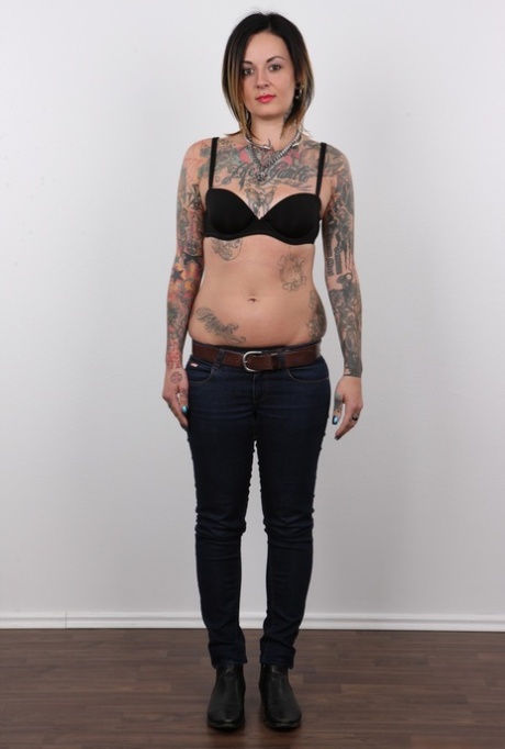 Tattooed Martina has her pierced pussy photographed naked for porn debut