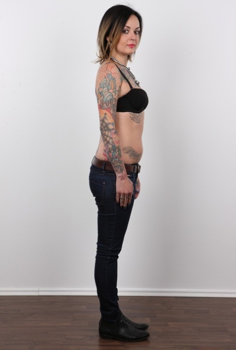 Tattooed Martina has her pierced pussy photographed naked for porn debut