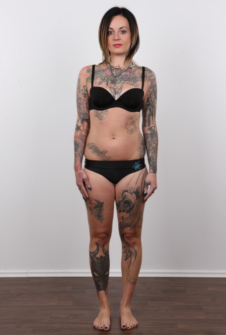 Tattooed Martina has her pierced pussy photographed naked for porn debut