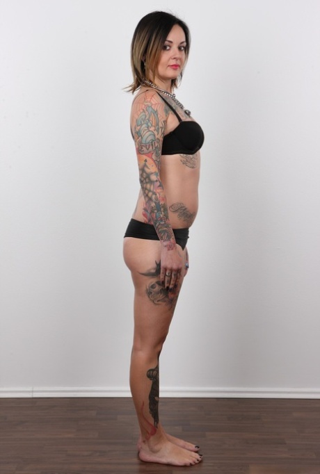 Tattooed Martina has her pierced pussy photographed naked for porn debut