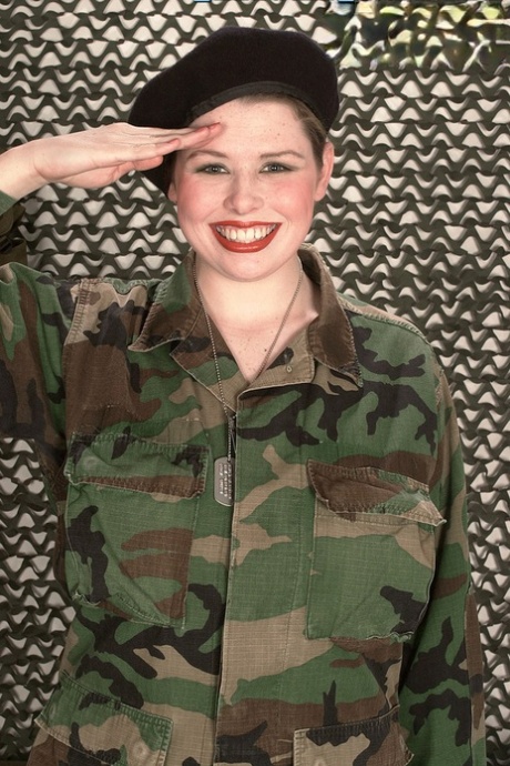 Chesty Desirae peels off her military uniform to fondle massive saggy juggs