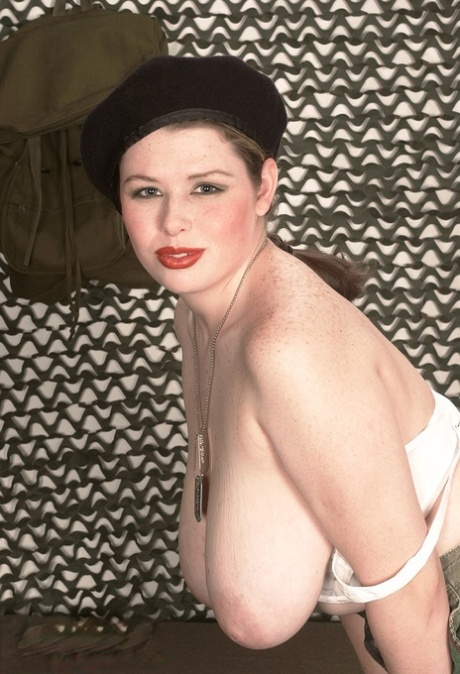 Chesty Desirae peels off her military uniform to fondle massive saggy juggs