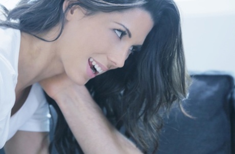 Dark haired girl seduces her man in cutoff denim shorts and cropped shirt