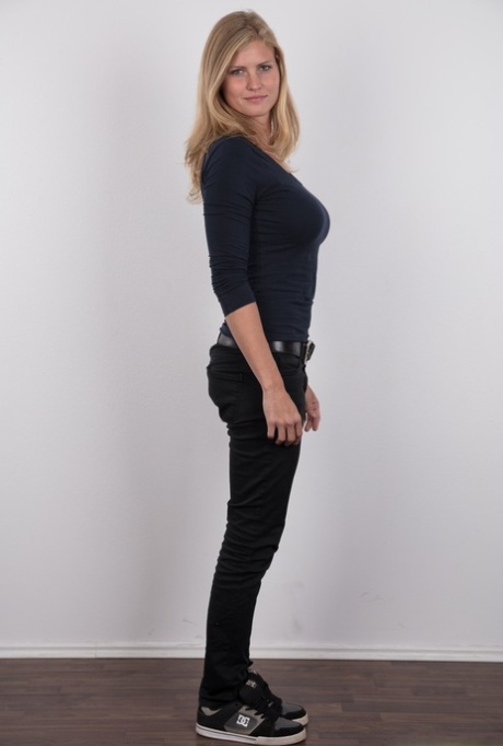 Pretty blonde Adriana strips off her jeans to show her big saggy boobs