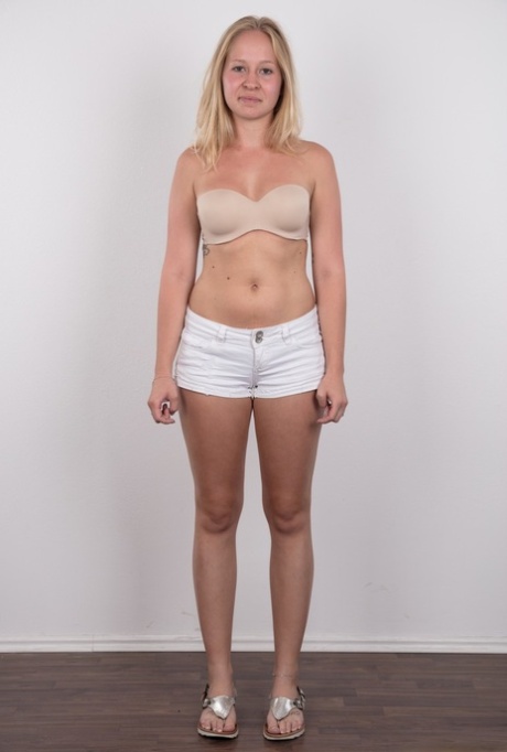 Blonde amateur Veronika exposes her tan lined tits in black underwear