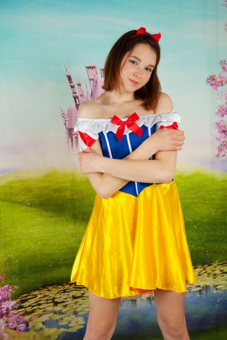 Cute teen cosplay girl Slava strips her costume to spread with bare feet