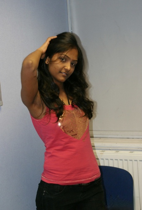 Desi solo girl holds her nice tits as she undresses to model in the nude