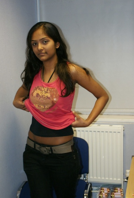 Desi solo girl holds her nice tits as she undresses to model in the nude