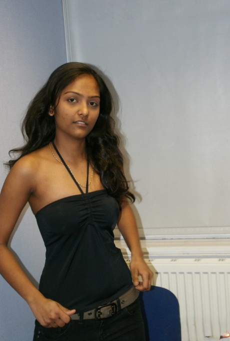 Desi solo girl holds her nice tits as she undresses to model in the nude