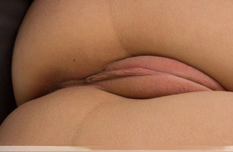 Cute young brunette Nika K shows puffy hot pussy close up and finger fucks