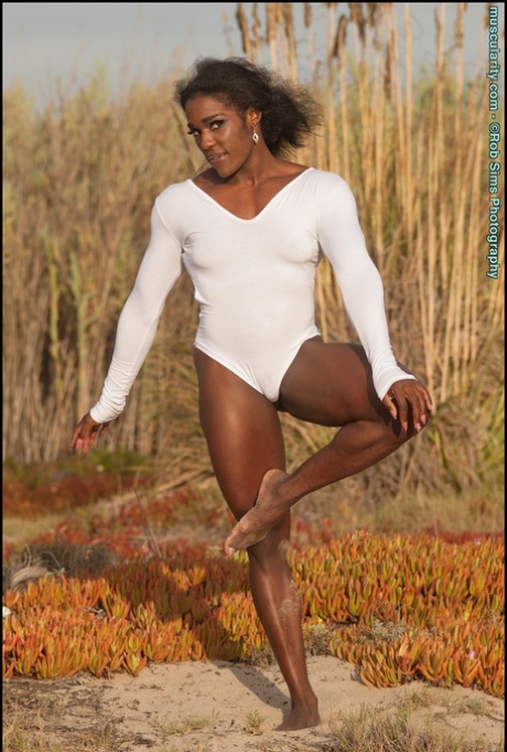 Ebony bodybuilder Jaquita Persons Taylor flexes outdoors in a SFW fashion
