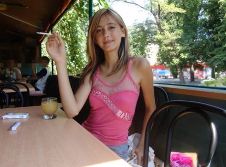 Dirty blonde teen flashes a no panty upskirt inside a restaurant