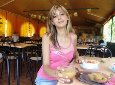 Dirty blonde teen flashes a no panty upskirt inside a restaurant