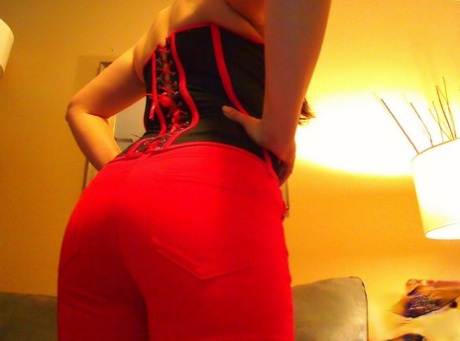 Solo girl Krissy sports braided pigtails while going topless in a red thong