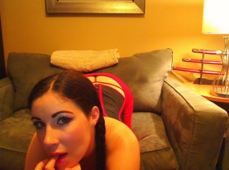Solo girl Krissy sports braided pigtails while going topless in a red thong