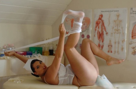 British BBW Matron Jenny slips out of nurse uniform and girdle