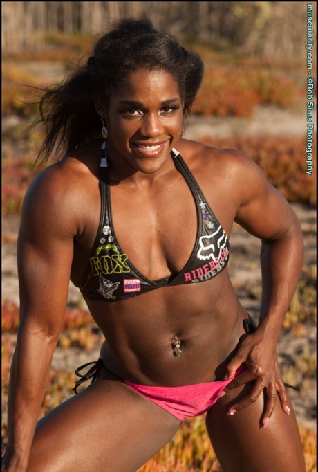 Ebony bodybuilder Jaquita Person Taylor models a bikini while outdoors