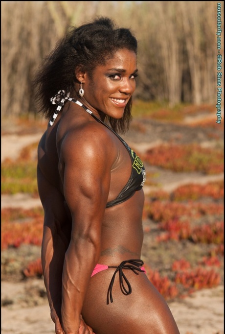 Ebony bodybuilder Jaquita Person Taylor models a bikini while outdoors