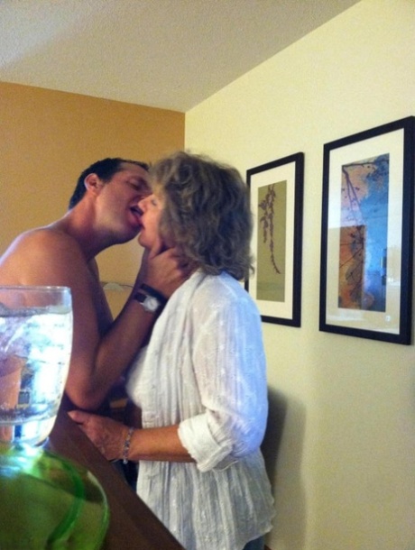 Horny granny BustyBliss oils up floppy tits & spreads pussy for hotel boy toy