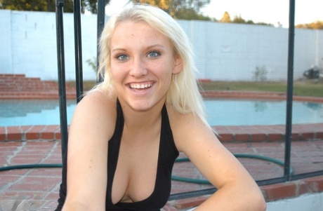 Blonde amateur Jordan smokes a cigarette while showing some cleavage
