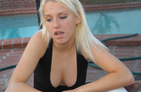 Blonde amateur Jordan smokes a cigarette while showing some cleavage