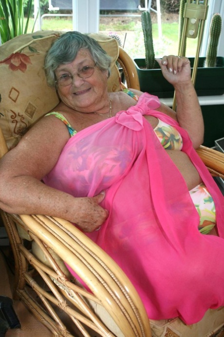 Horny old granny in glasses disrobes to reveal huge saggy tits & big BBW ass