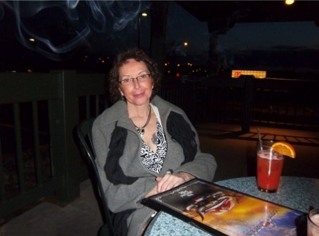 Curly haired mature woman likes sending her younger partner provocative photos