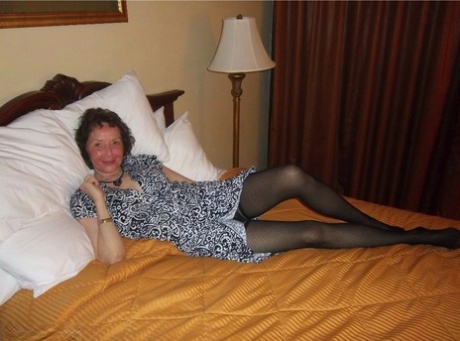 Curly haired mature woman likes sending her younger partner provocative photos