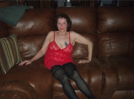 Curly haired mature woman likes sending her younger partner provocative photos