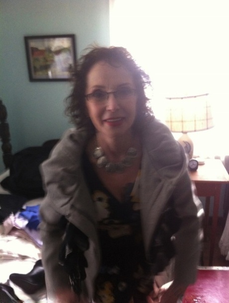 Curly haired mature woman likes sending her younger partner provocative photos